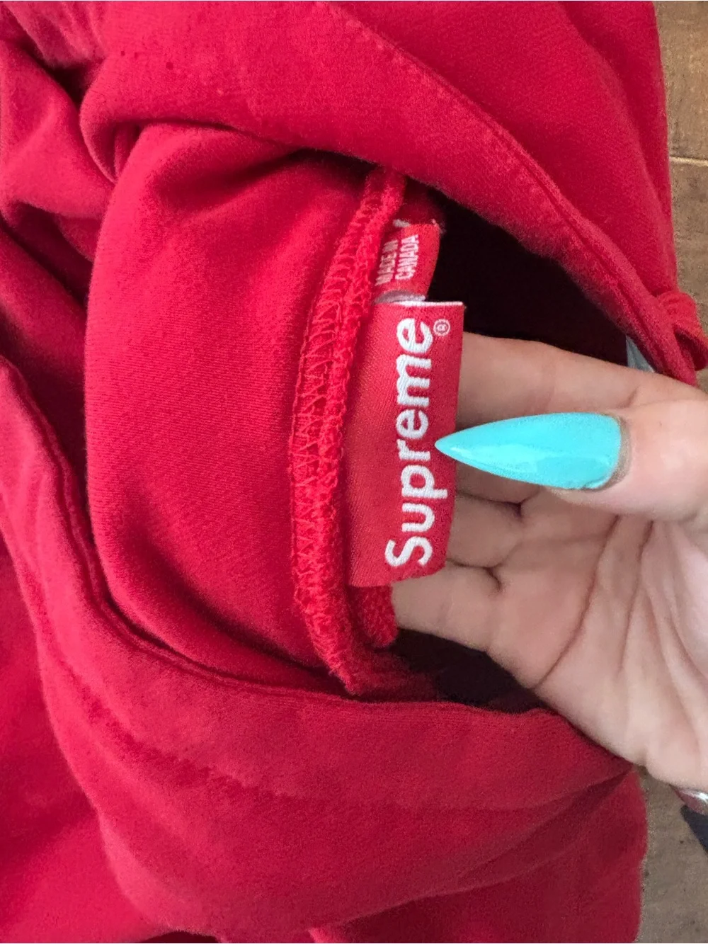 Supreme Red Hoodie with White Logo Tag